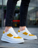 Men's Artemis Helio by Apollo Moda, white sneaker with yellow accents, second angle