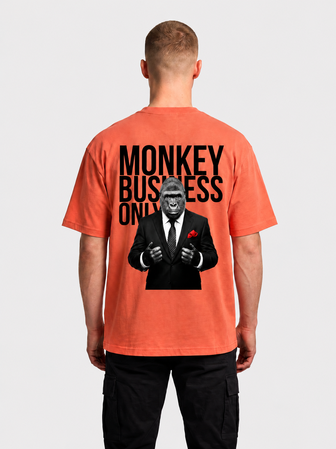 Monkey Business Only oversized graphic tee in orange by Apollo Moda, worn by model